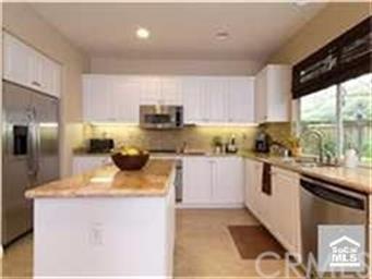 Remodeled kitchen with custom back splash