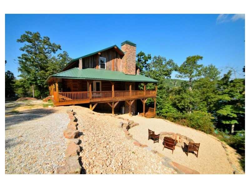 Exterior Front. Enjoy this 2,638sqft solid log hom