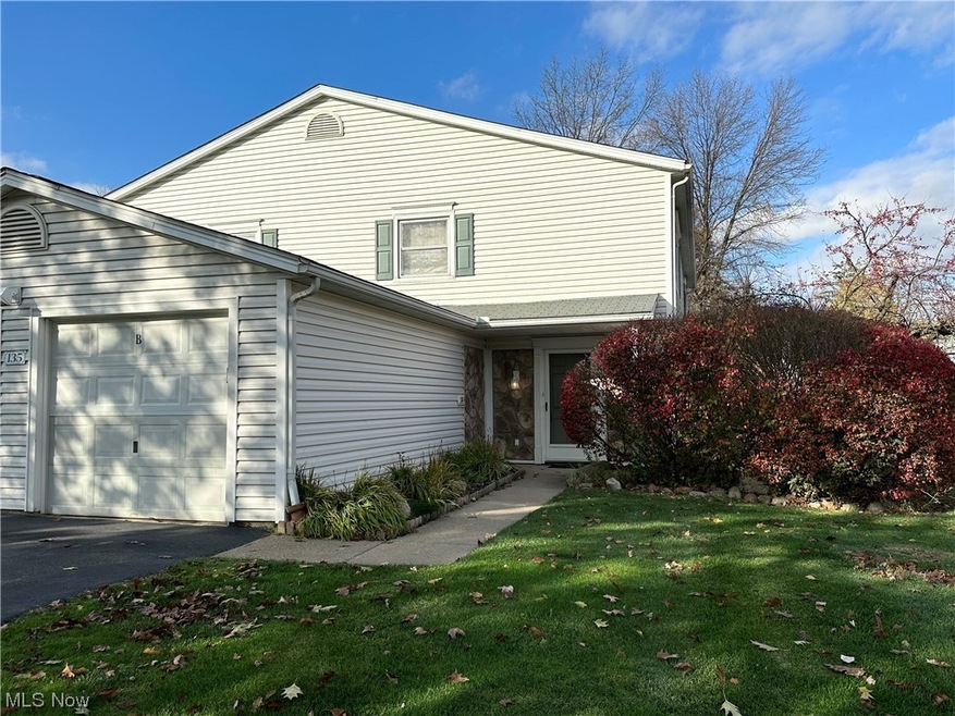 Front of property with a front lawn and a garage