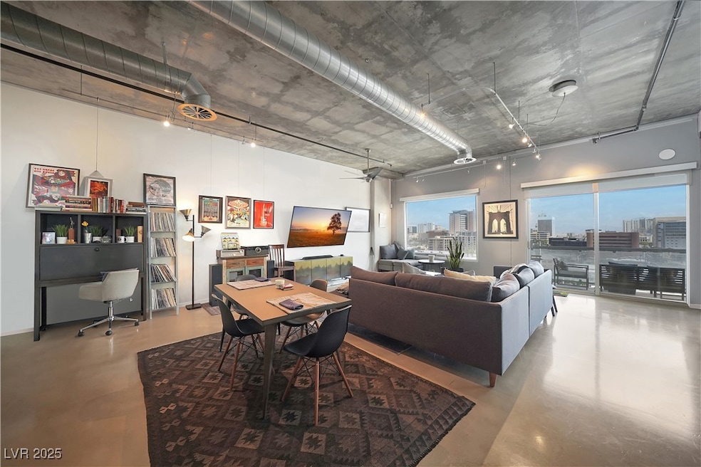 Dining area featuring concrete floors, a desk, a h