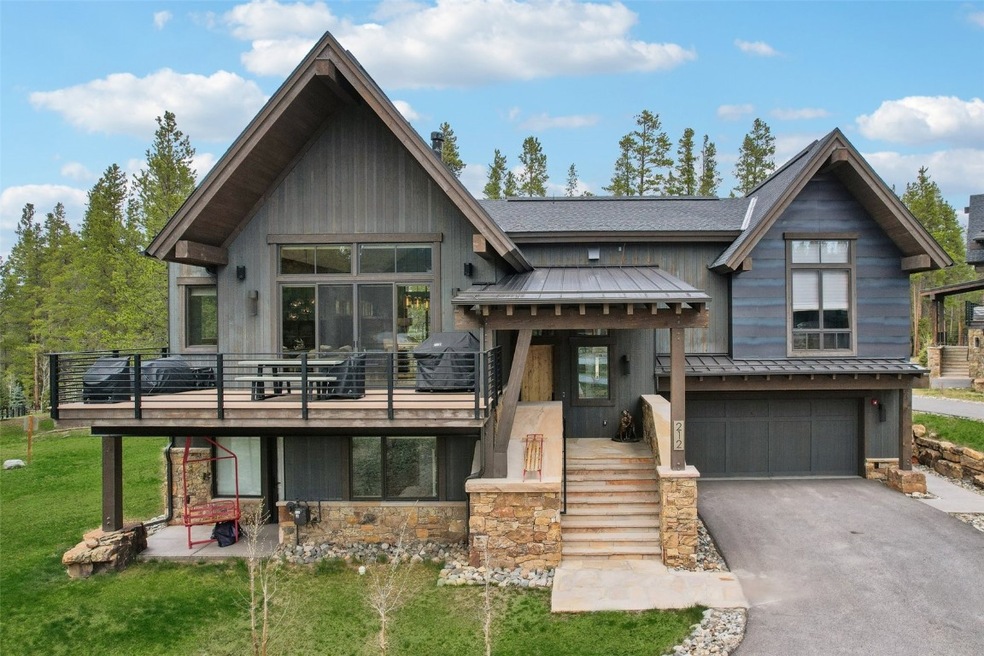 View of front of house with a standing seam roof,