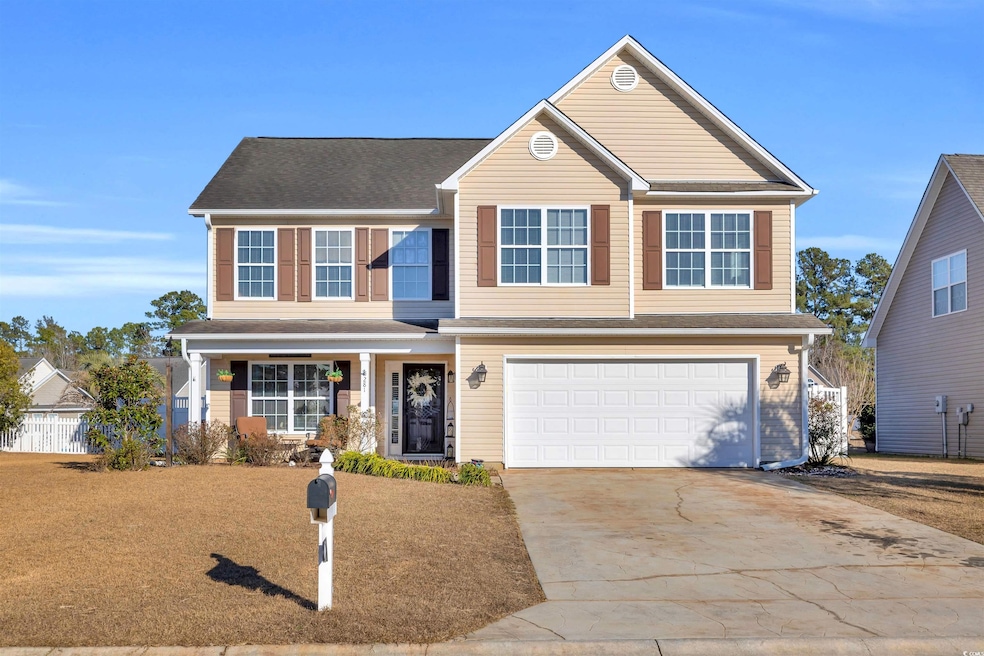 View of front of home featuring a garage