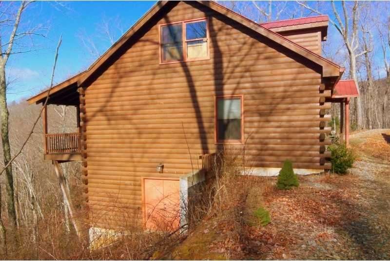 Exterior Front. Double door entry to basement; rei