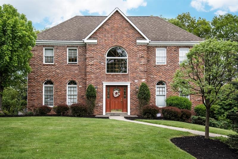 This beautiful all brick home has a very private s