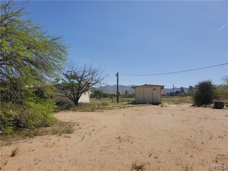 From just inside of gate facing home and one of the outbuildings.  Fully fenced and cross fenced. City water and watering system throughout. Nice location right off of pavement with great views.  You can change the house but you can't change the location.