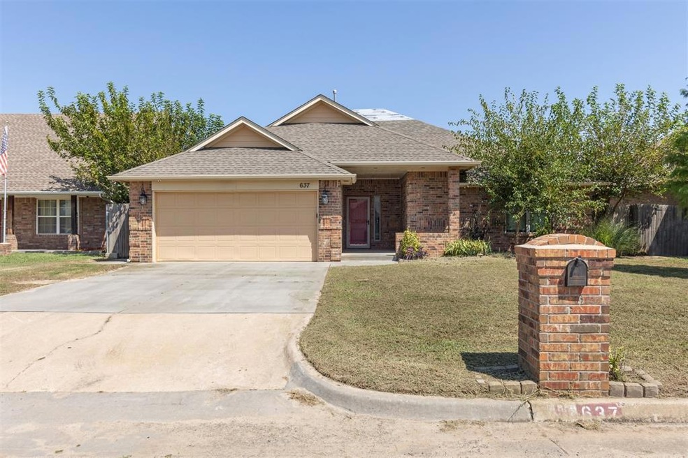 Ranch-style house featuring roof with shingles, a front yard, a garage, concrete driveway, and brick siding