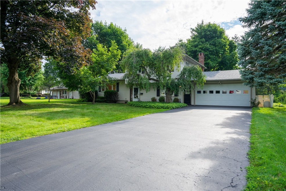 Welcome home to 699 Shadow Wood Lane in Webster -