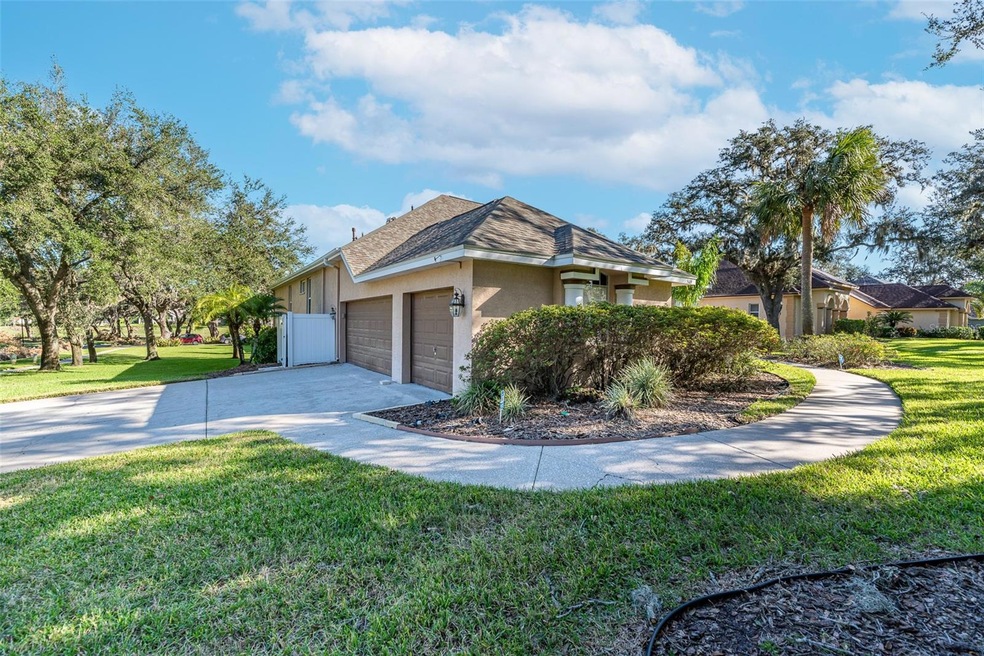 3 car side-entry garage and walkway to front door.
