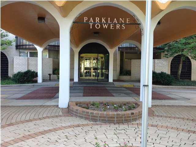 Elegant Front Covered Entrance with Security Guard