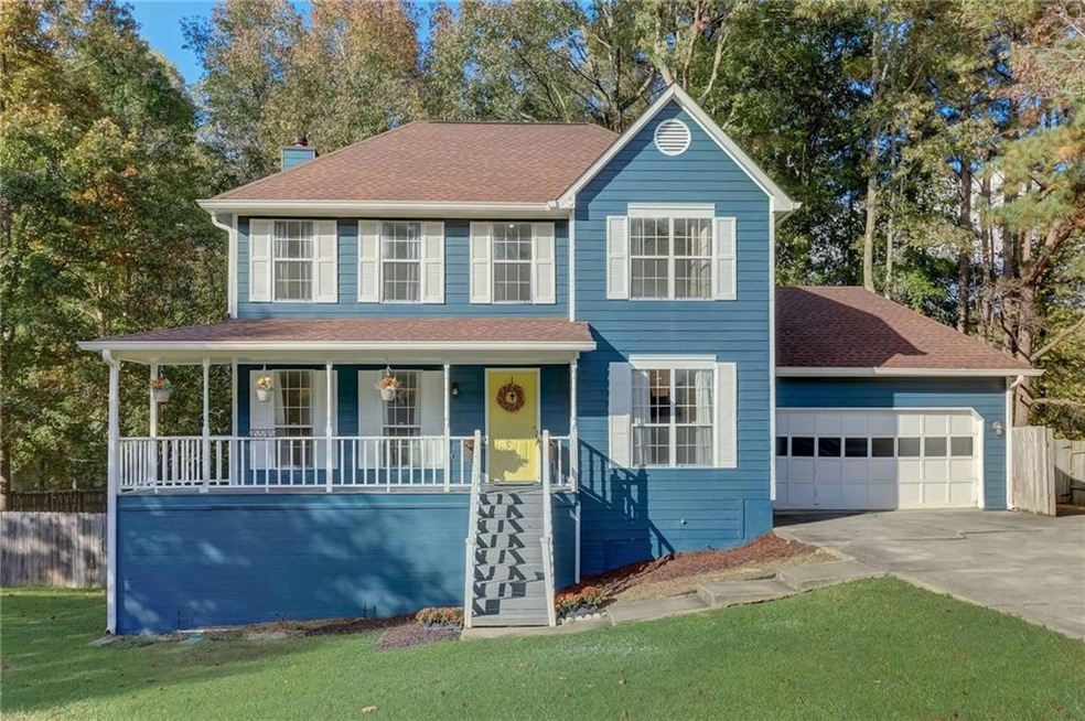 View of front of property featuring a porch, a fro