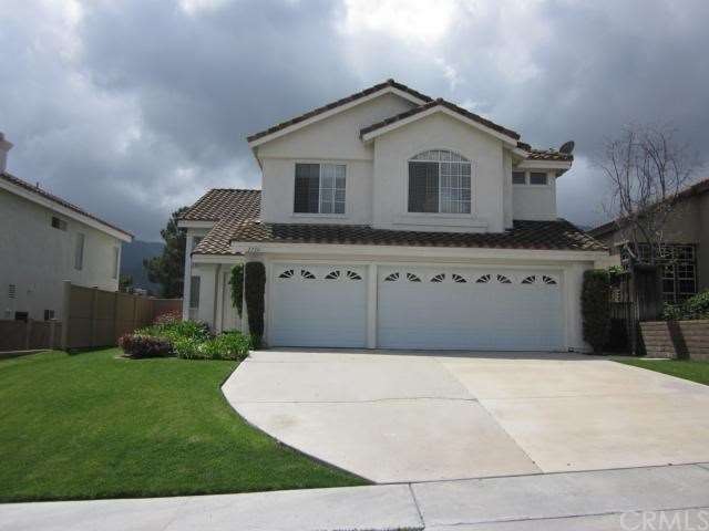 Large driveway with 3 car garage