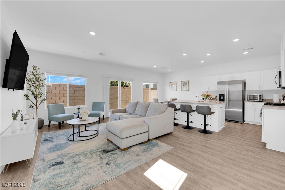Living area featuring recessed lighting, visible v