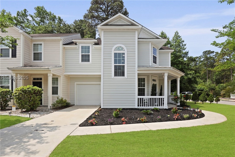End Unit with grage, driveway and side parking.