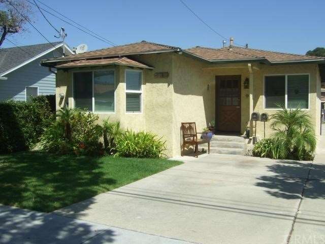 Front house has landscaped front and a parking pad