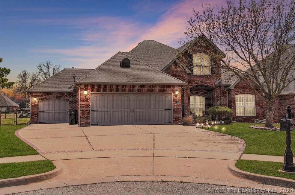 Full brick home with three-car garage; backs to Go