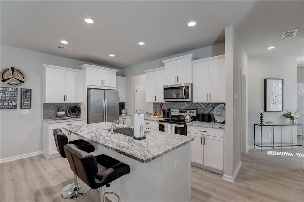 Kitchen with appliances with stainless steel finis