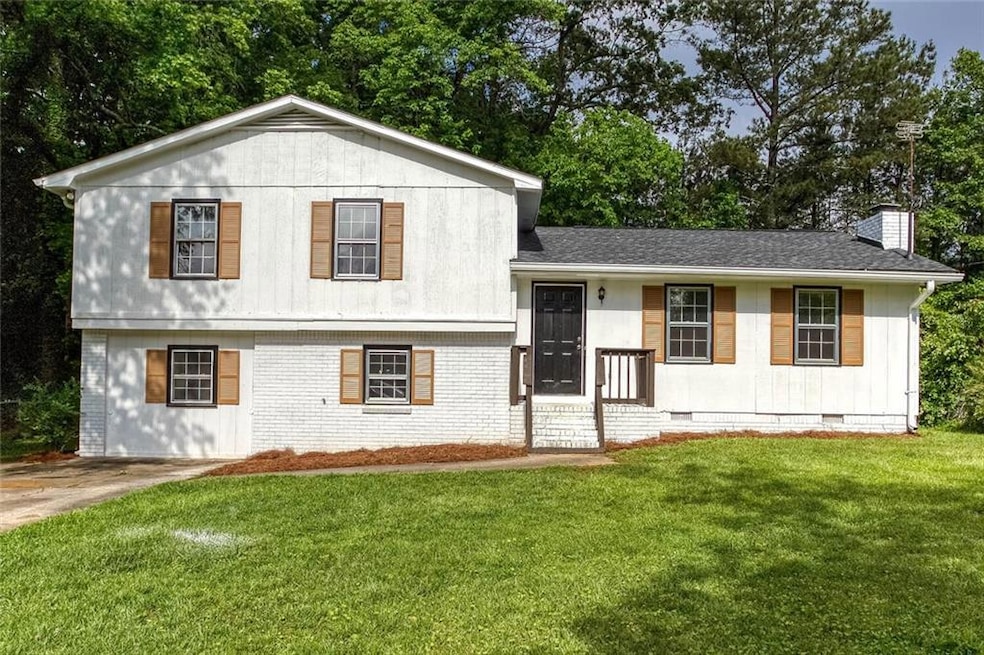 Split level home featuring crawl space, a chimney,