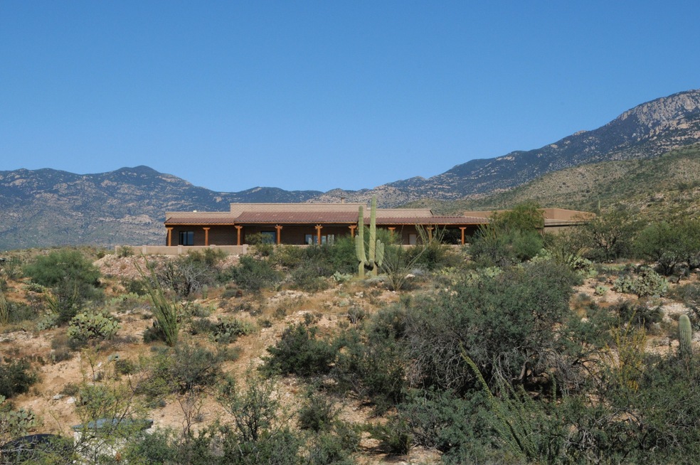 Picture of back of home &  covered patio
