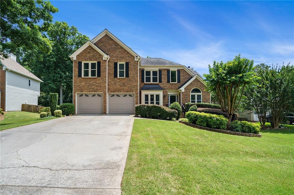 View of front of home featuring a garage and a fro