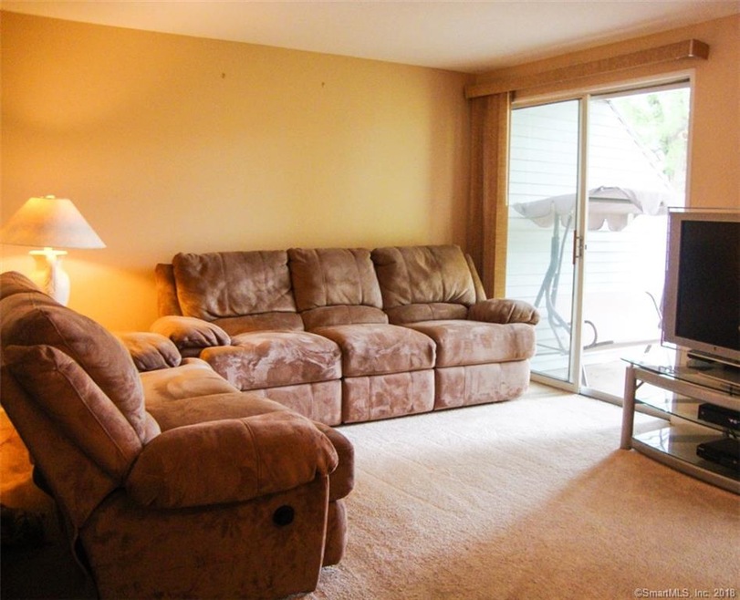 Living Room with sliding door to back patio and po