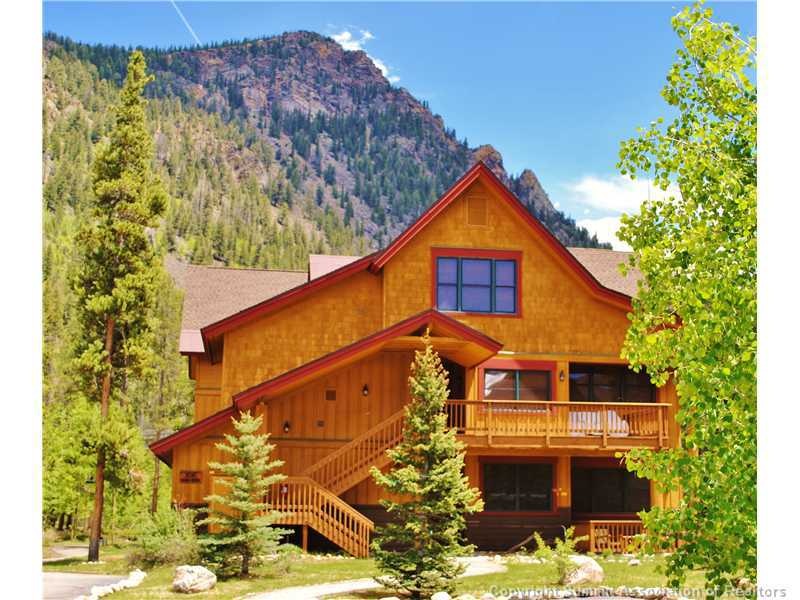 Exterior Front. Porcupine Peak looms large over th