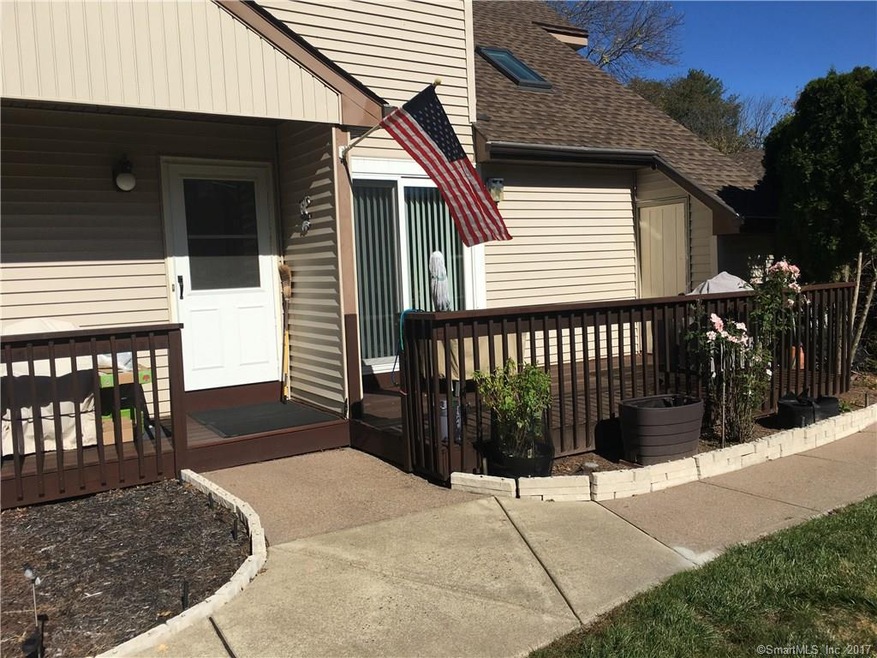 Front door and deck eading into condo