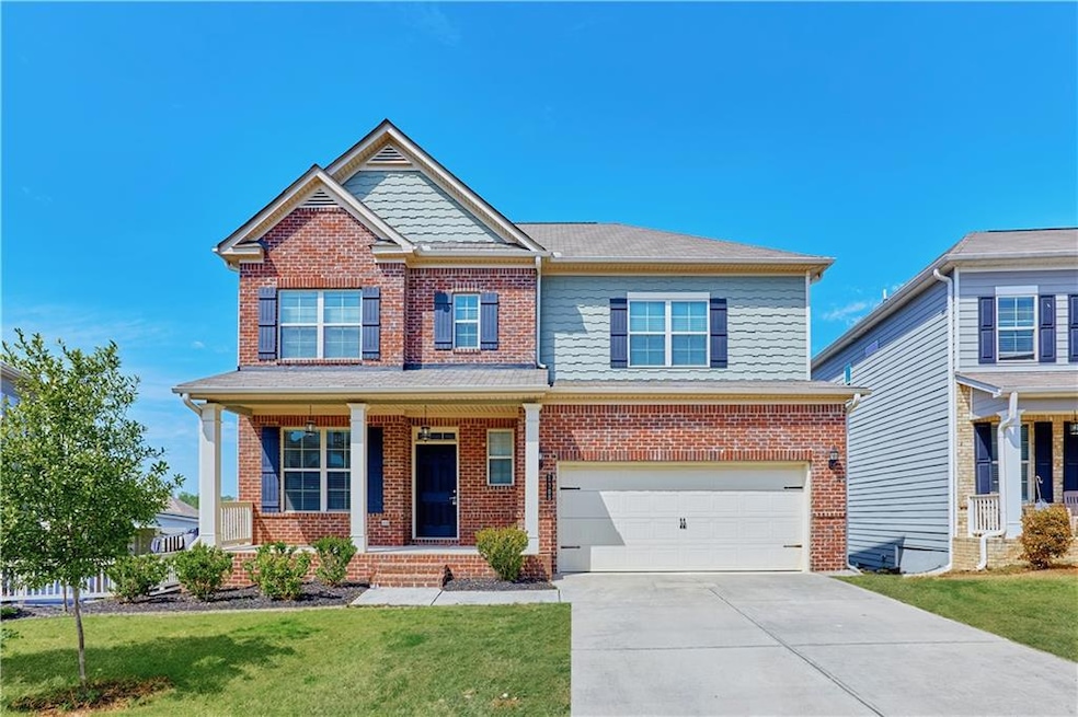 Craftsman inspired home featuring a garage and a f