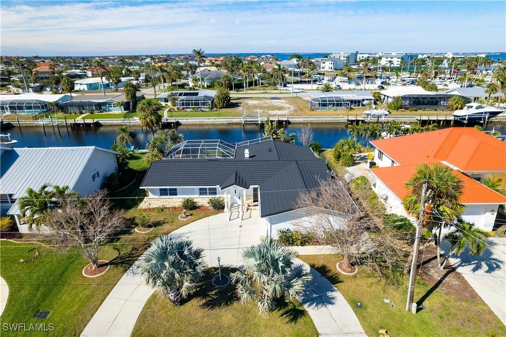Bird's eye view with a water view and a residentia