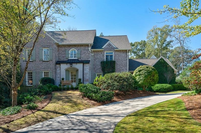 Four sided brick home with an architectural shingl