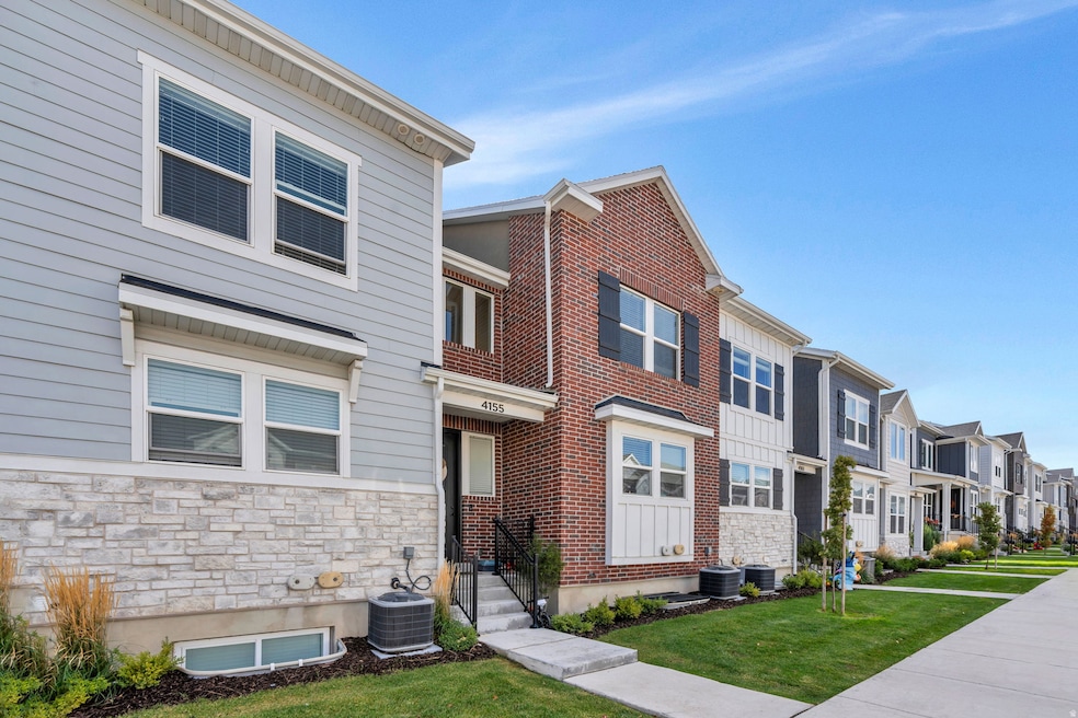 View of front facade with a residential view, stone siding, and a front yard