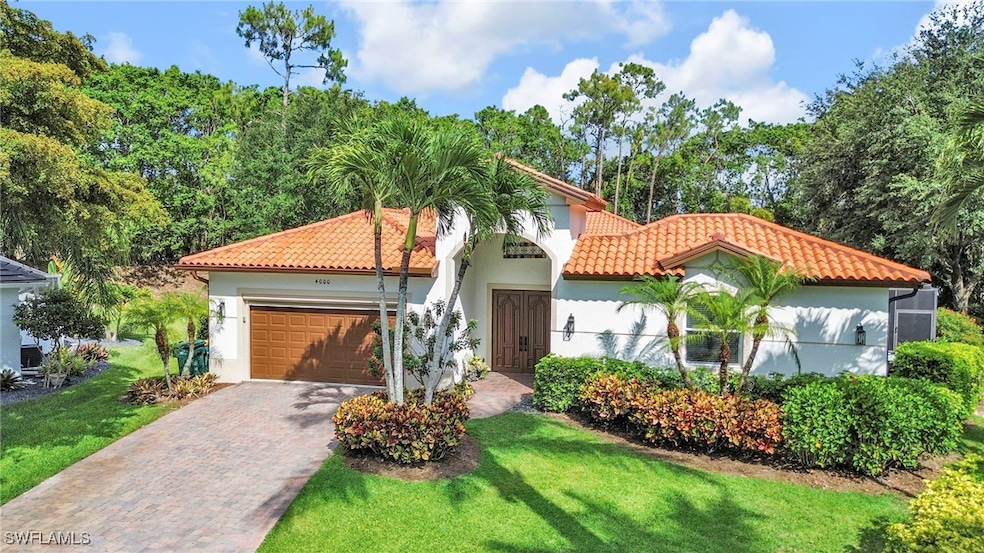 Mediterranean / spanish home with a tiled roof, an