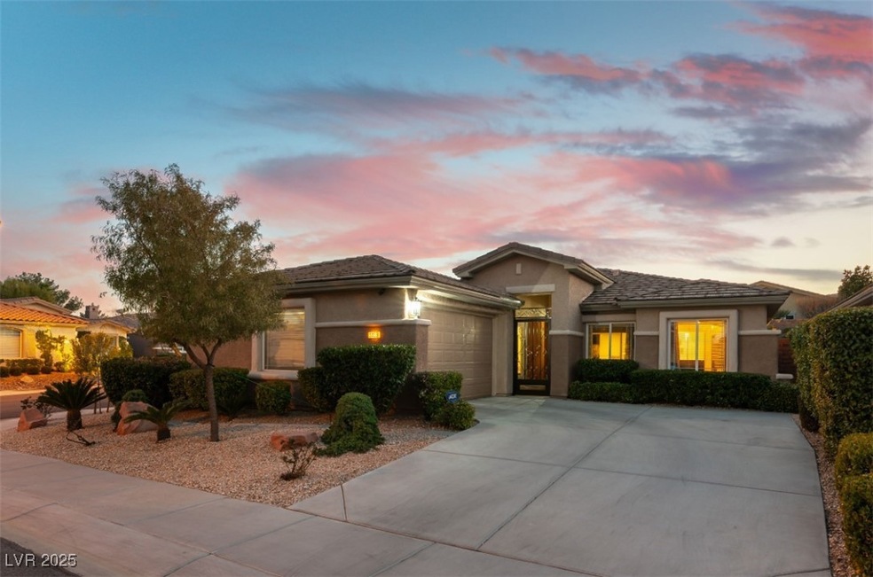 View of front of house with a garage, concrete dri