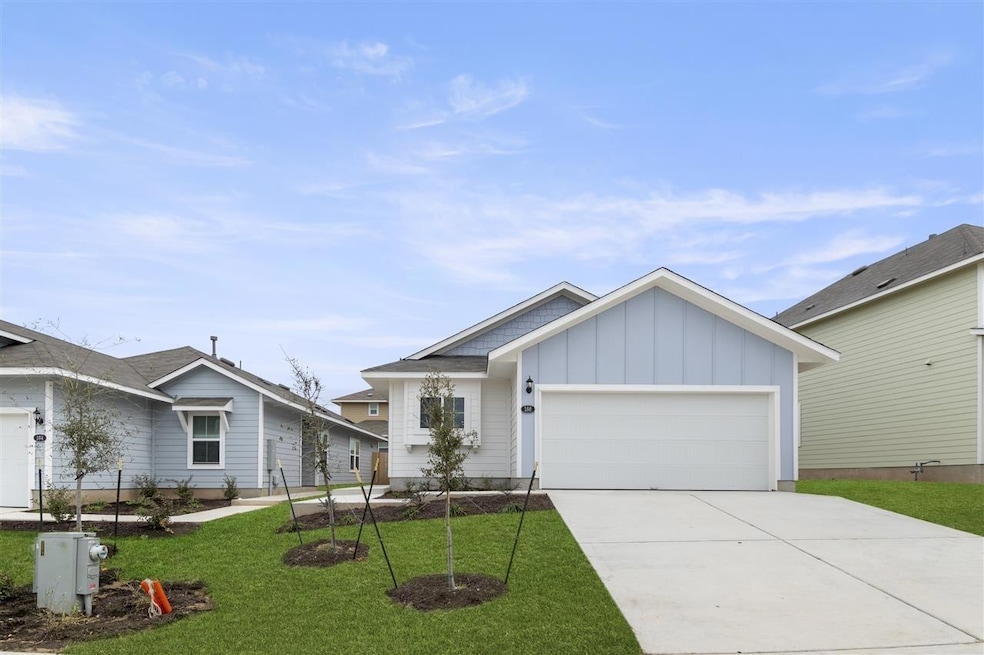 Ranch-style home featuring board and batten sidin