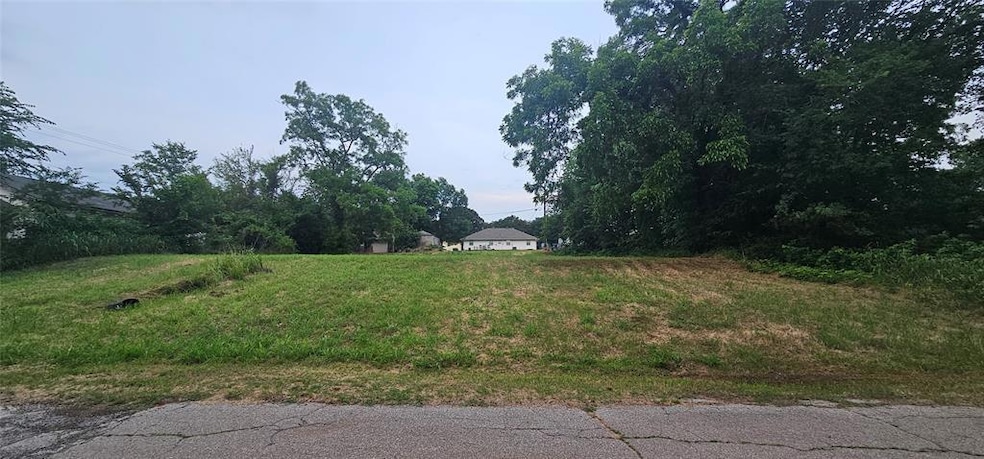 Approximate center of frontage looking east toward alley