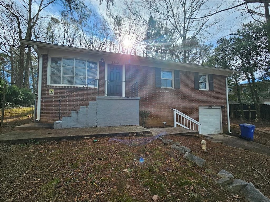 View of front of property with a garage