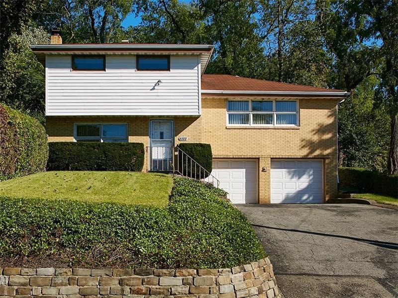 Front exterior with two car integral garage.