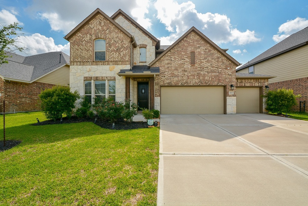 Welcome to 1911 Orchard Berry Lane in Young Ranch. Home features a 3 car garage and stone and brick elevation