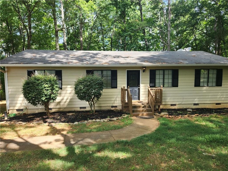 Ranch-style home with a front yard