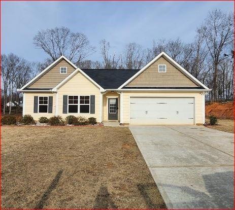 View of front of home featuring a garage and a fro