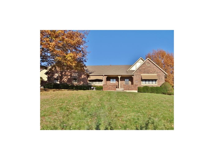 This home also offers a spacious yard & brick exterior.