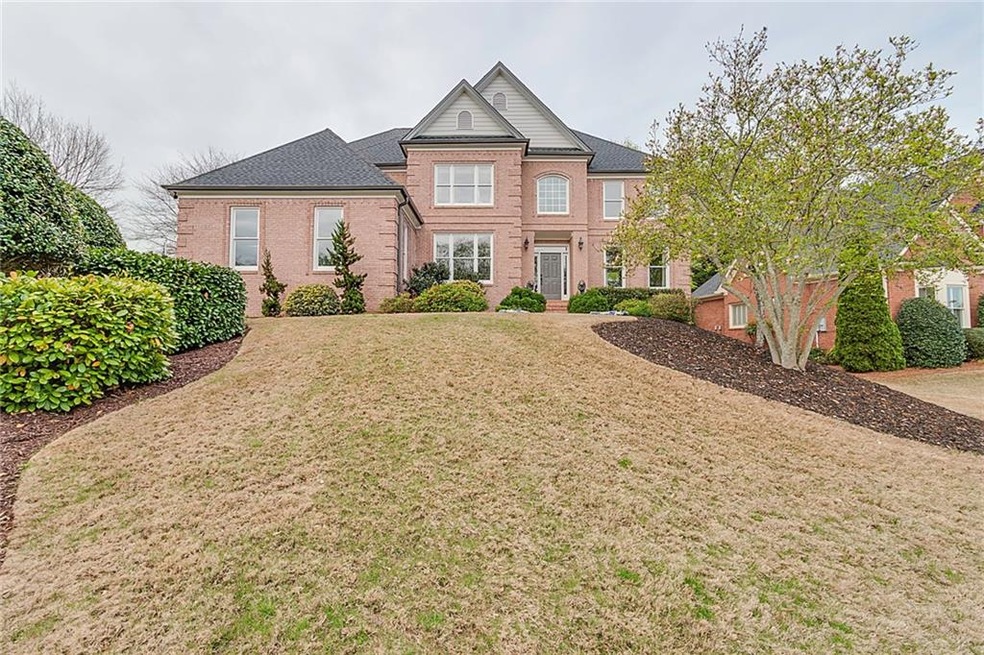 Stately Brick Home with three car side entry garag