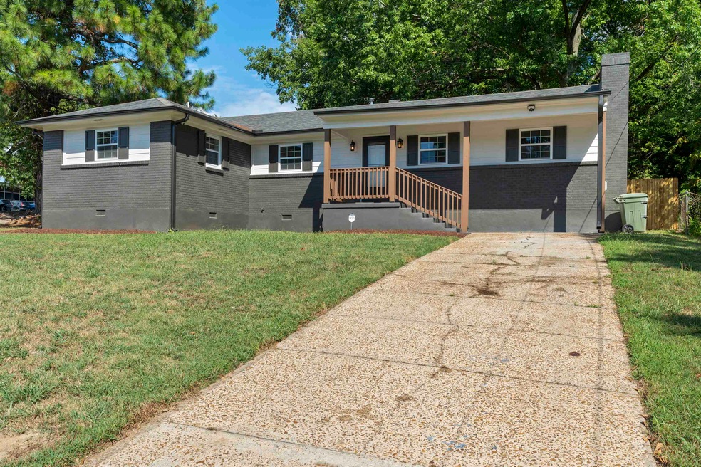 View of front of property with a front yard and a 