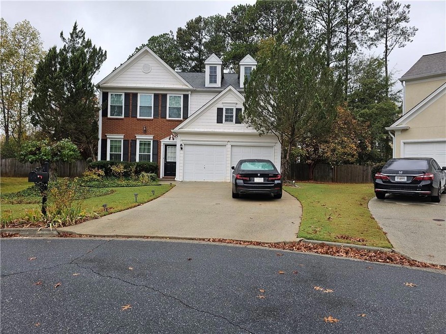 View of front of house featuring a garage and a fr
