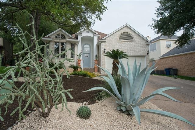 Natural landscaping. Welcoming front entry makes t