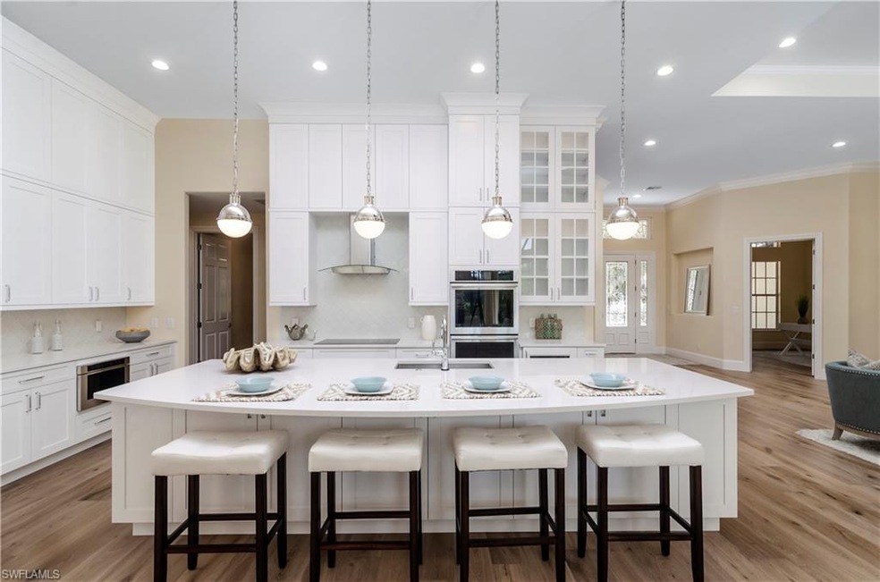 Redesigned Island Kitchen with Double Ovens and Wa