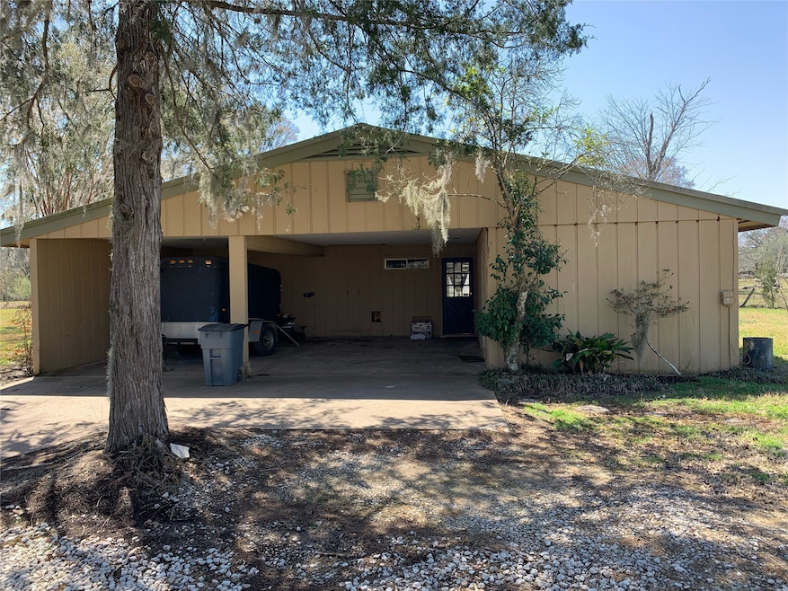 Two space carport with the entrance to the home.