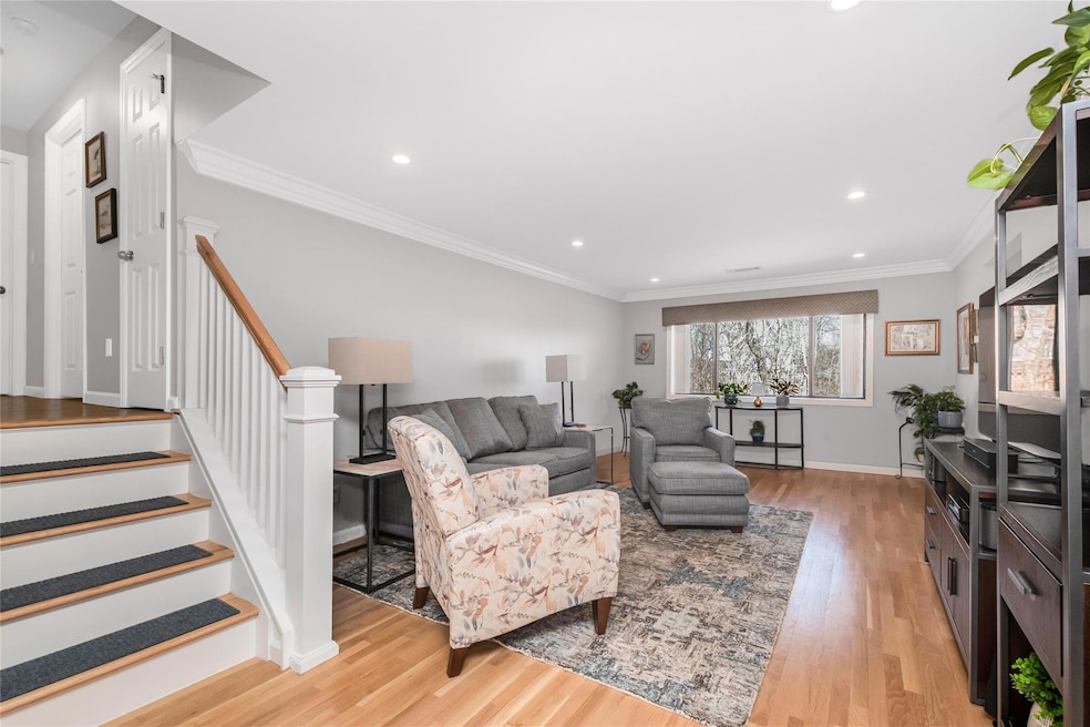 Living Room with crown moldings and access to two bedrooms including master bedroom and two full baths.