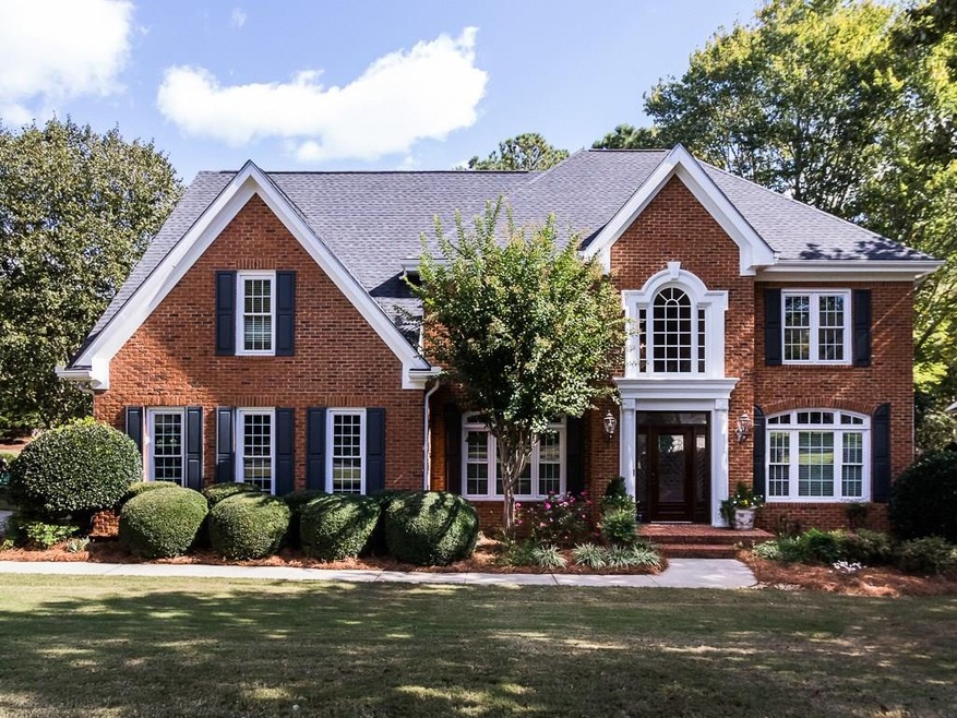 Brick & Hardiplank home w/ side entry garage; over