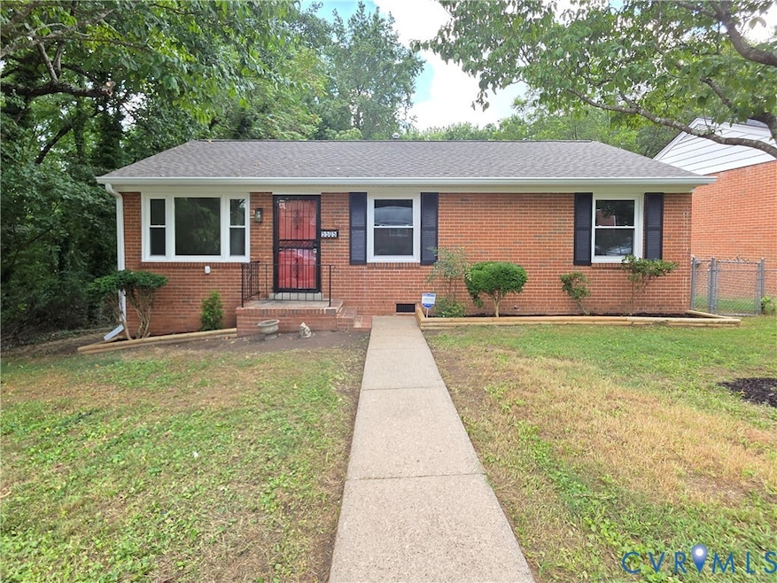 Ranch-style house featuring brick siding and roof with shingles
