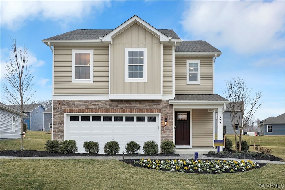 View of front of house featuring a garage and a fr